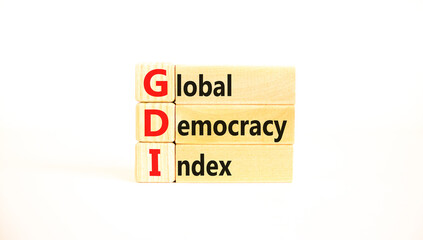 GDI global democracy index symbol. Concept words GDI global democracy index on wooden blocks on a beautiful white table white background. Business and GDI global democracy index concept. Copy space.