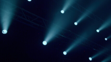 Flashing spotlights on dark stage. Stock footage. Flashing spotlights on stage for show. Spotlights...