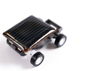 Solar powered toy car using small cells isolated on white background. Educational concept for solar powered cars, copy space