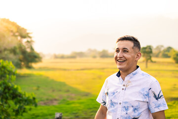 Latino man enjoying outdoor life in a green countryside