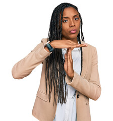 African american woman wearing business jacket doing time out gesture with hands, frustrated and...