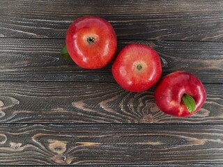 Ripe, juicy apples on wooden background