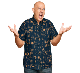 Middle age bald man wearing casual clothes crazy and mad shouting and yelling with aggressive expression and arms raised. frustration concept.
