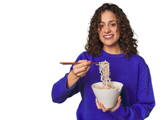 A young caucsian woman eating noddles with chopsticks, very happy