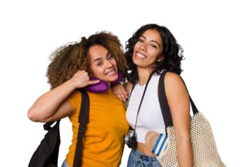 Two diverse friends on a beach vacation with vintage camera, beach bag, and travel pillow showing a mobile phone call gesture with fingers.