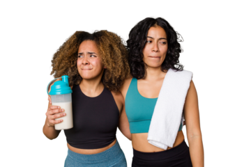 Two best friends are ready to go to the gym, one of them holds a protein shake, confused, feels doubtful and unsure.