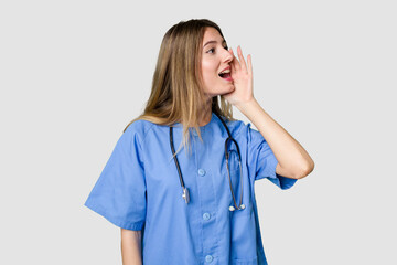 Young female nurse in uniform with stethoscope, symbol of care and dedication to patients having some great idea, concept of creativity.