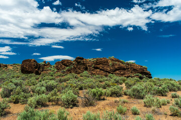 Rock outcropping under blue sky