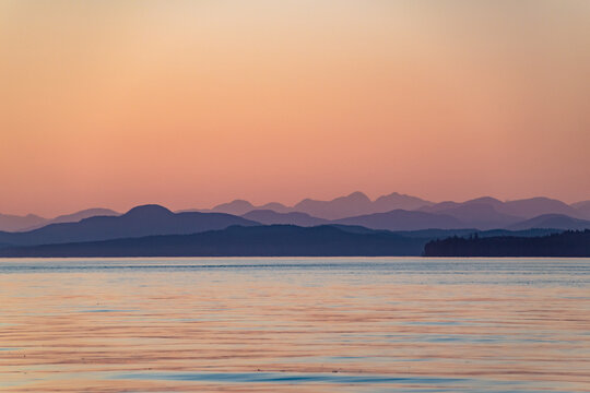 Beautiful Sunset With Purple Mountains on Strait of Georgia in Vancouver Island , British Columbia, Canada