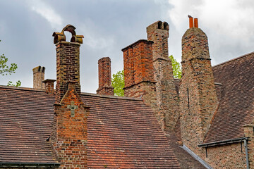 A closeup of centuries old roofs and chimneys in a small town in Belgium.