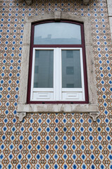 Typical tiled facade in Lisbon with window