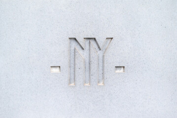Clean concrete wall texture with NY lettering. 4k photorealistic texture	
