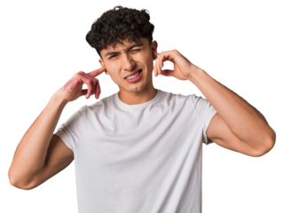 Young latin man covering ears with fingers, stressed and desperate by a loudly ambient.