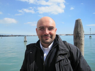 Venice holiday picture of a man smiling at the camera in Venice in a sunny day