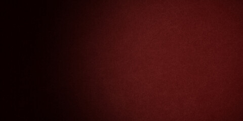Red background in Christmas or valentines day red color with vintage texture and shiny spot light