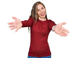Young blonde woman wearing casual clothes smiling cheerful offering hands giving assistance and acceptance.