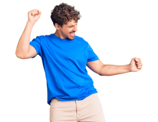 Young handsome man with curly hair wearing casual clothes dancing happy and cheerful, smiling moving casual and confident listening to music