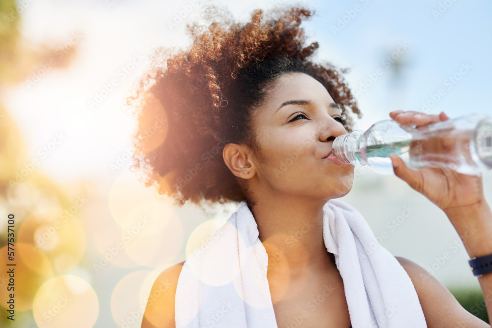 Poster Maintaining good hydration also supports healthy weight loss. Cropped shot of a young woman enjoying a bottle of water while out for a run.