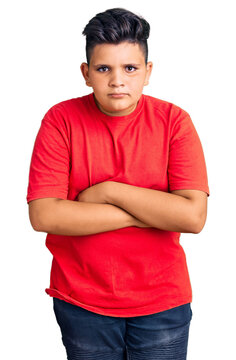Little boy kid wearing casual clothes skeptic and nervous, disapproving expression on face with crossed arms. negative person.