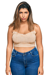 Fototapeta premium Beautiful brunette woman wearing casual clothes skeptic and nervous, frowning upset because of problem. negative person.