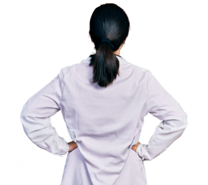 Young chinese woman wearing doctor uniform and stethoscope standing backwards looking away with arms on body