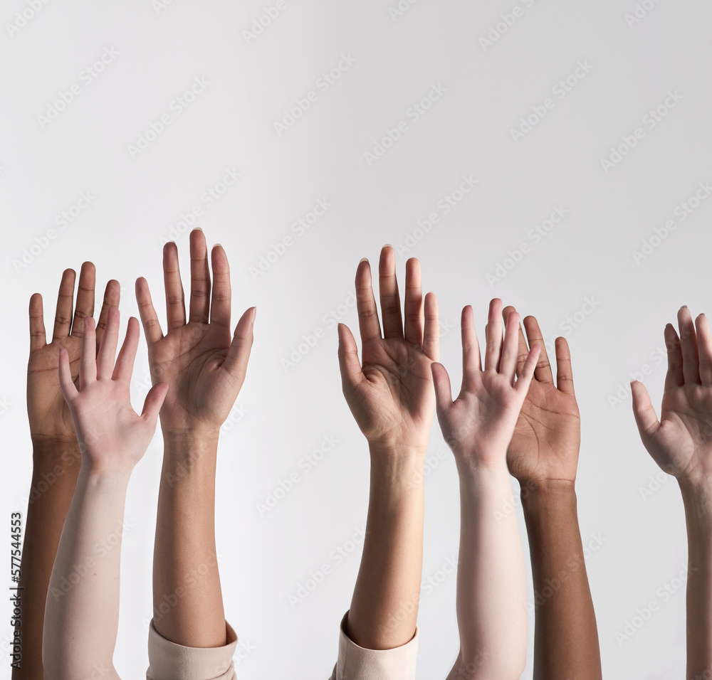 Aufkleber making their voices heard. shot of a diverse group of unidentifiable people holding their hands up a