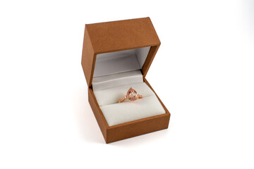 Rose gold pear shaped engagement ring with box for proposal