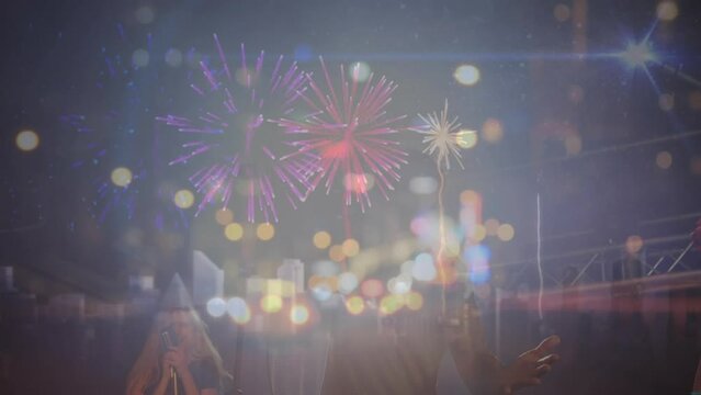 Animation of cityscape and fireworks over concert