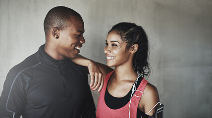 Naklejka premium They love staying fit together. Shot of a sport young couple out for a run.