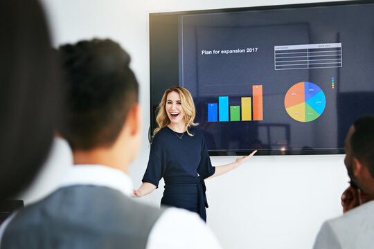 Weve Seen Massive Growth. Shot Of A Businesswoman Giving A Presentation To Her Colleagues At Work.