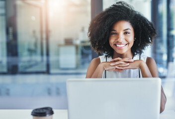 Taking the time to reflect on the business. Cropped shot of an attractive young businesswoman in her office.