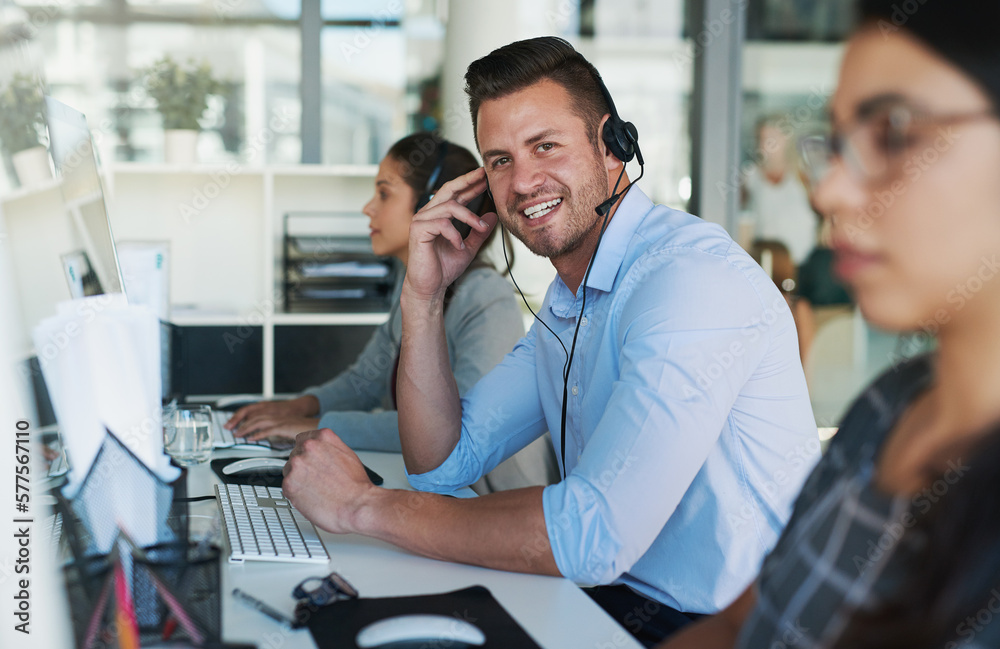Poster customer care you can count on. portrait of a happy and confident young man working in a call center