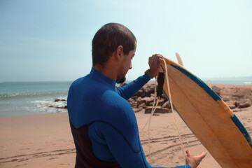 surfer getting ready to enter the sea