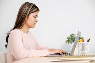 Young asian woman concentrate on working with laptop computer at home office, Asia office female comtemplate on working with laptop computer, home office lifestyle concept, online education