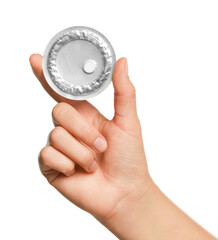 Woman holding blister of emergency contraception pill on white background, closeup