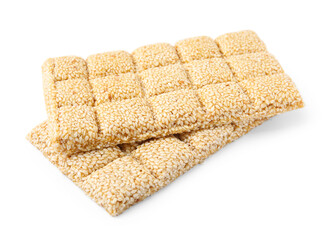 Tasty sesame kozinaki bars on white background