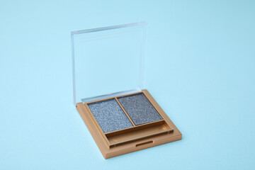 Beautiful eye shadow palette on light blue background