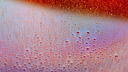 Drops of water. Abstract gradient backdrop Colored texture of a drop. Rainbow gradient. Heavily textured image. Shallow depth of field. Selective focus