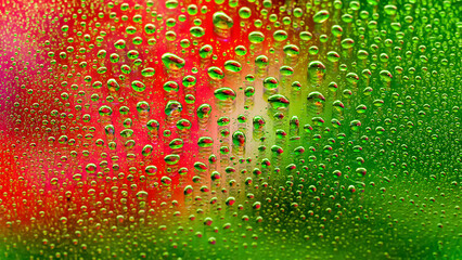 Water drops. Abstract gradient background. Colored drop texture. Green-red gradient. Heavily textured image. Shallow depth of field. Selective focus