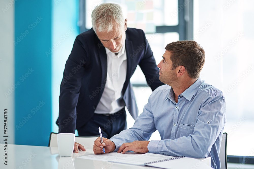 Poster collaborate with people you can learn from. shot of two businesspeople having a discussion in a corp