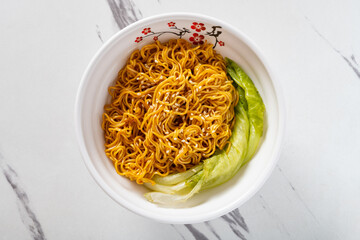 top view bowl of noodles with cabbage