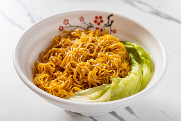 angle view bowl of noodles with cabbage