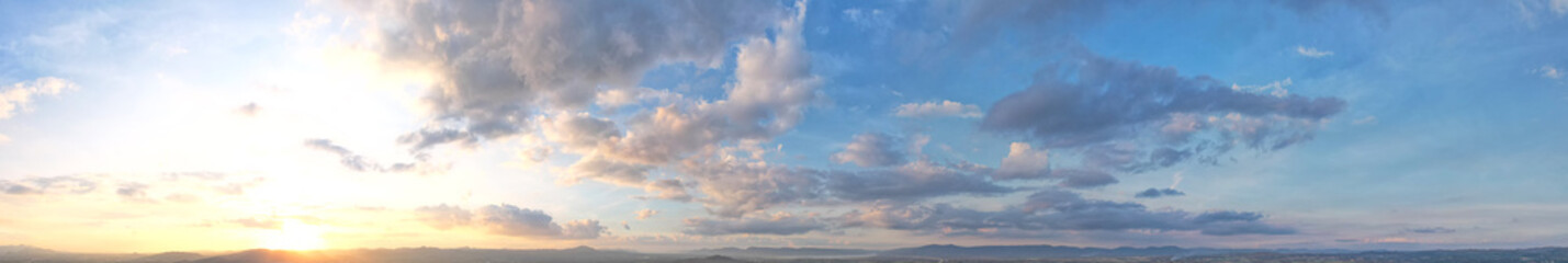 Naklejka na ściany i meble The morning light shines on the soft blue panoramic clouds.