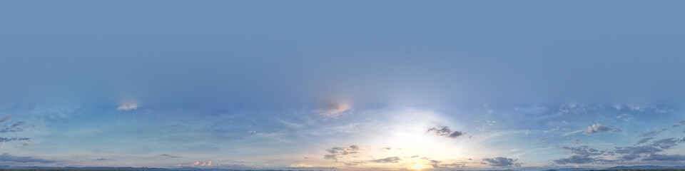 The hard blue sky was flooded by soft sunlight surrounded by slightly dark blue panoramic clouds.