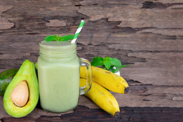 Avocado fresh cocktail smoothies fruit juice beverage healthy the taste yummy in glass drink episode good morning on wooden background.
