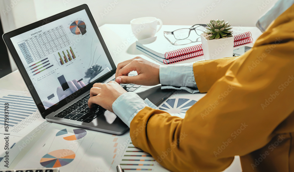 Aufkleber accounting concept. businesswoman working using calculator with money stack in office