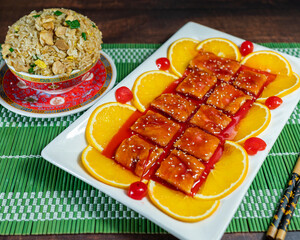 kam lu wantan with orange pieces and chaufa rice. Peruvian Chinese food. Chifa