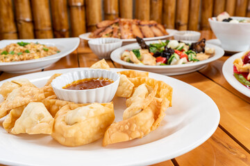 Chifa, half dozen of fried wantan with tamarind. peruvian food. chaufa rice, chicken tausi, wantan soup.