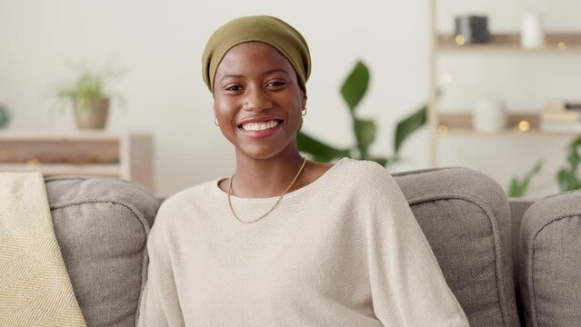 Black woman, happy face and living room sofa with a African person sitting with a relax smile. Home lounge, happiness and female portrait in a household feeling calm in the morning ready to start day