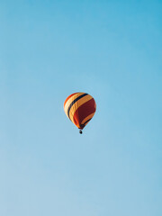 a hot air balloon in the blue sky.